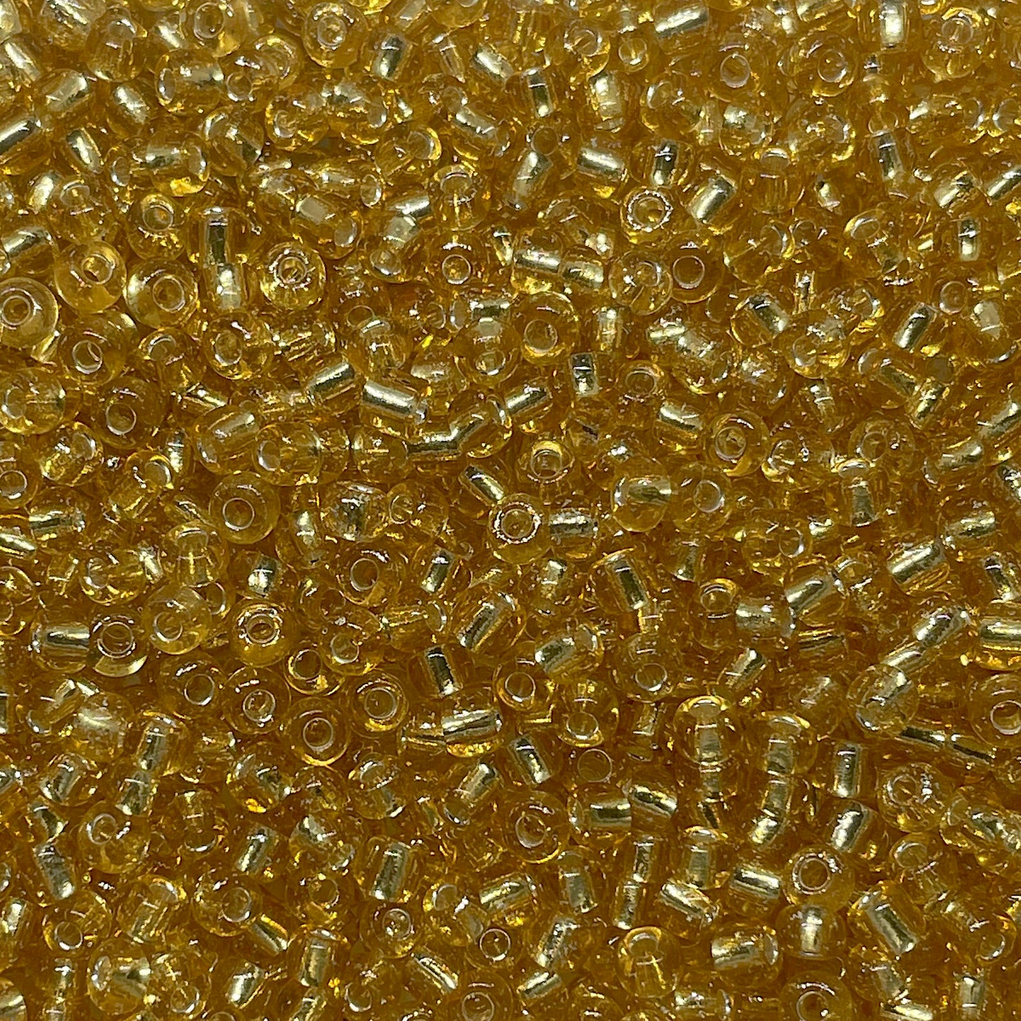 Mostacillón 6/0 - 4mm - 30gr - Ambar Glass