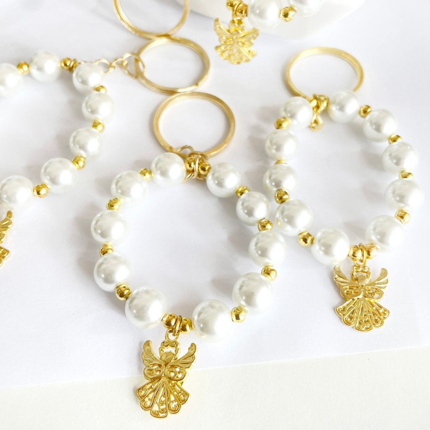 Denario llavero de Perla con Ángel - 10und