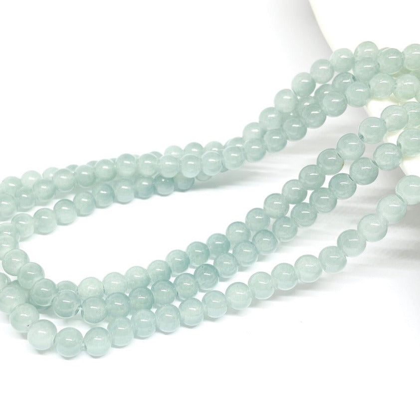 Perla de vidrio - 6mm - Tira 70und aprox. - Gris claro