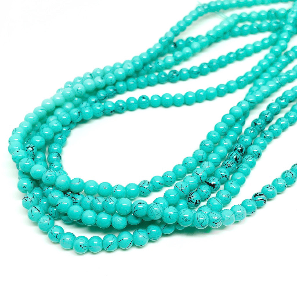 Perla de vidrio - 4mm - Tira 100und aprox. - Verde agua con diseño