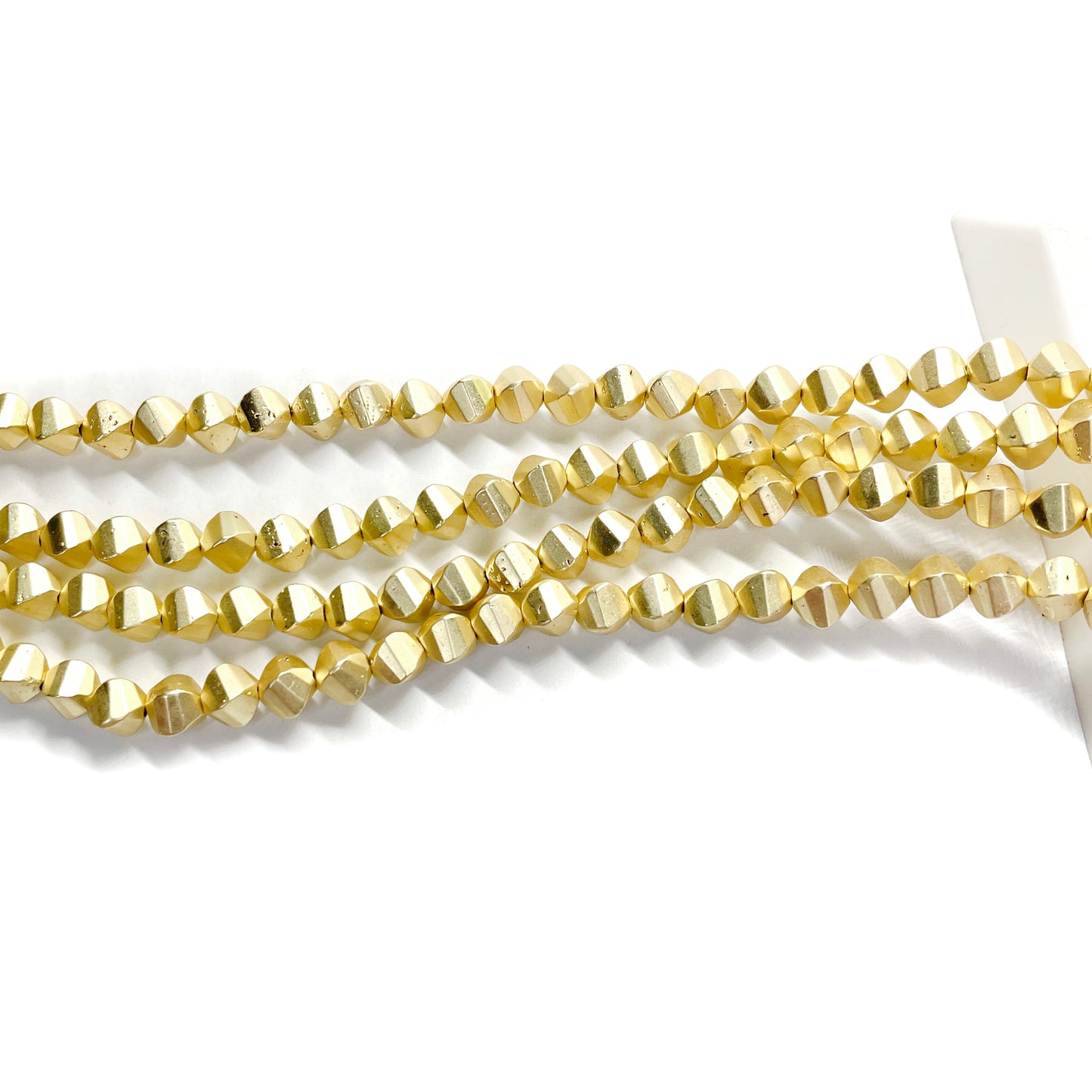 Hematita Rombo 5x6mm - Dorado Matte - 35und aprox