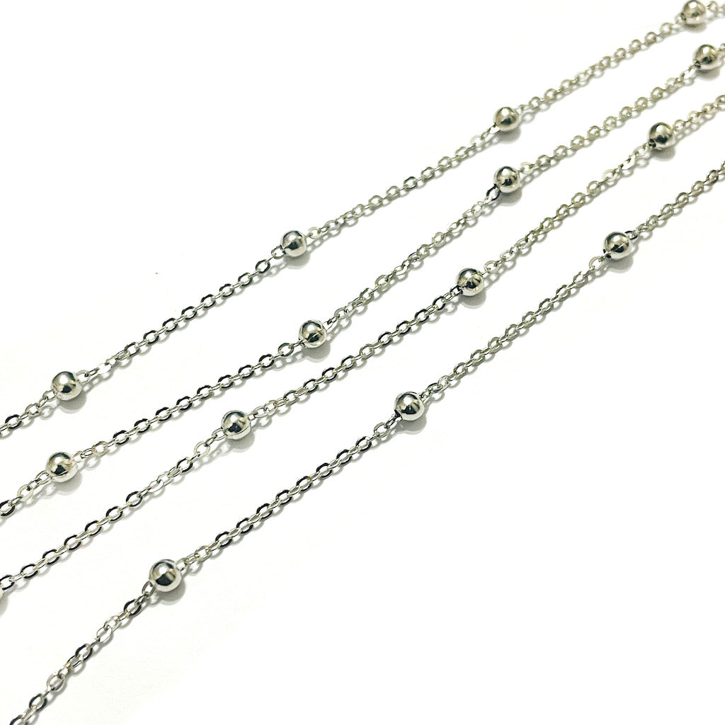 Cadena Niquelada eslabón plano con bolita 1,5x1mm | Por Metro